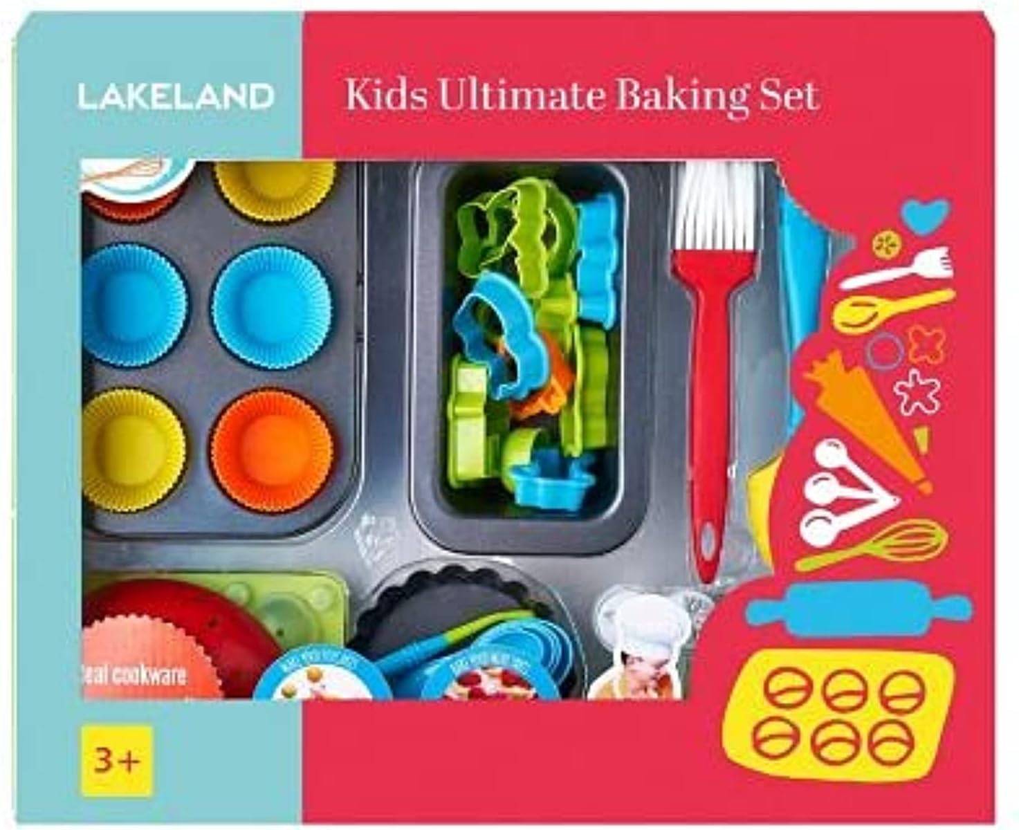 Lakeland Kids Ultimate Baking Set a photograph of a brightly coloured red and blue box with see through area to see a baking set inside including cookie cutters baking pans silicone brush and cupcake cases the box has the words Lakeland Kids Ultimate Baking Set on it