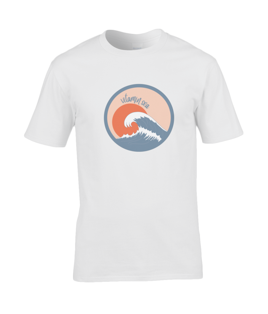 A photo of a white mens t-shirt with a round Vitamin Sea design featuring a large wave in front of a low orange sun