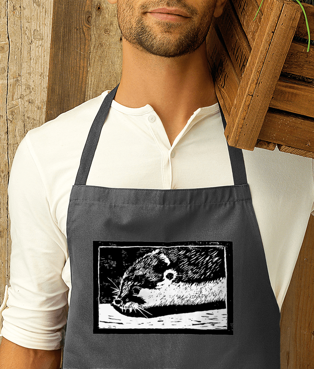 a photograph of a man carrying a crate and wearing a dark grey apron featuring a linocut design of an otter